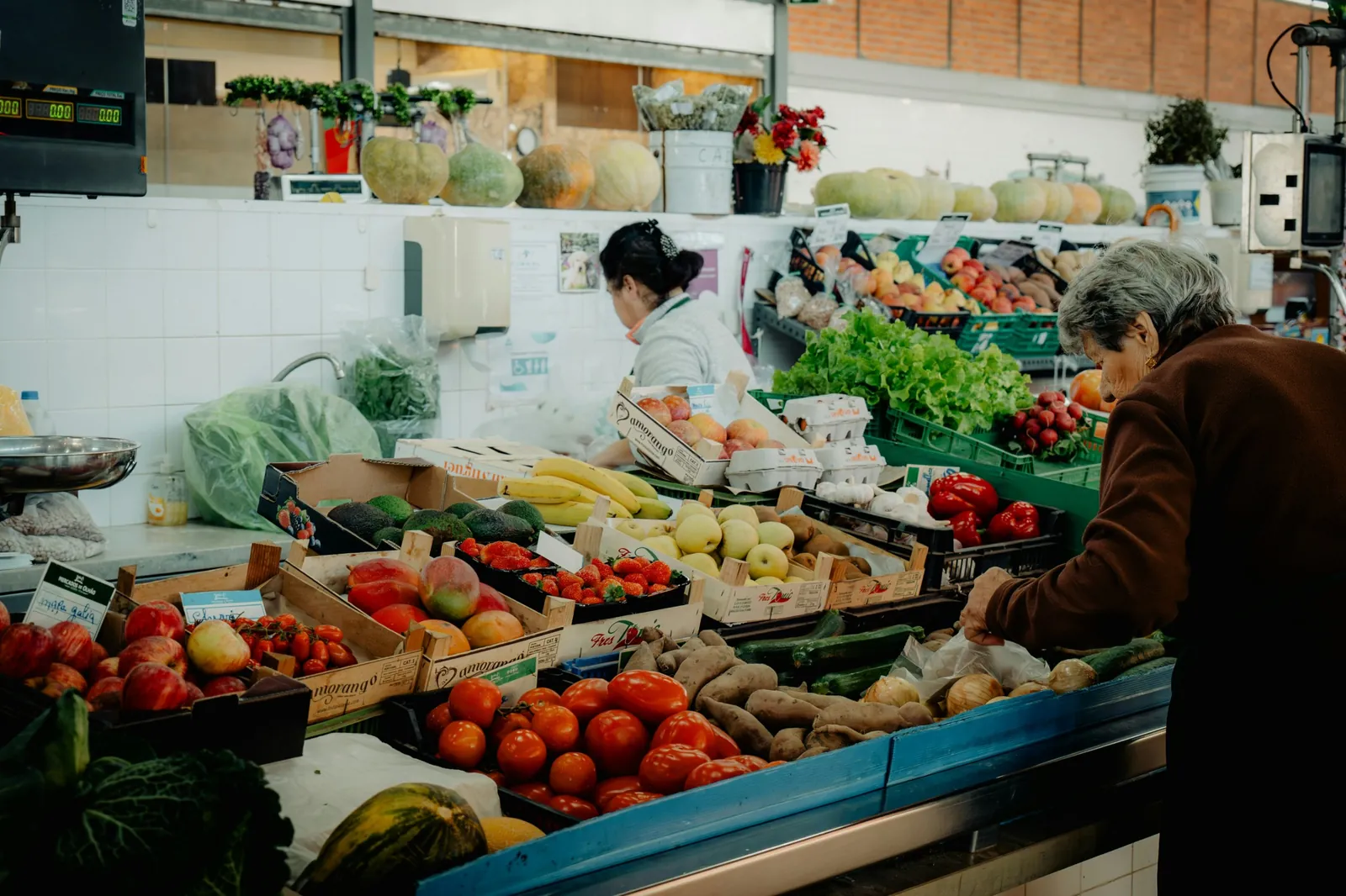 Sweet potatoes and vegetables on a municipal market stall in the Algarve